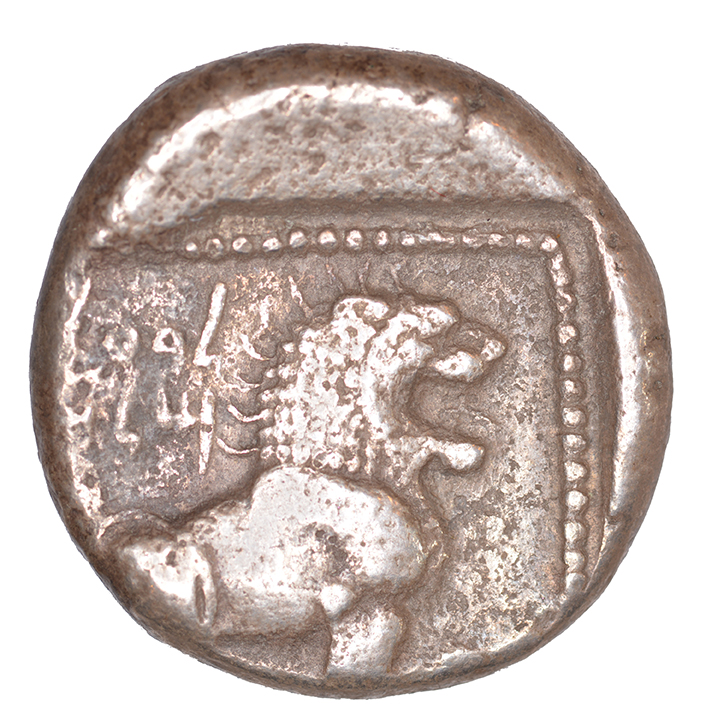 Reverse 'SilCoinCy A1043, acc.no.: KP 1238.6. Silver coin of king Baalmilk I of Kition 475 - 450 BC. Weight: 0.69 g, Axis: 6h, Diameter: 21mm. Obverse type: Heracles advancing r. holding club and bow. Obverse symbol: -. Obverse legend: - in -. Reverse type: Lion seated r.. Reverse symbol: -. Reverse legend: l’blmlk in Phoenician. '-'.