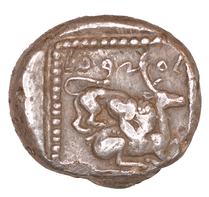 Reverse 'SilCoinCy A1047, acc.no.: KP 1185.109. Silver coin of king Ozibaal of Kition 450 - 425 BC. Weight: 0.78 g, Axis: 3h, Diameter: 22mm. Obverse type: Heracles advancing r. holding club and bow. Obverse symbol: -. Obverse legend: - in -. Reverse type: Lion devouring stag r.. Reverse symbol: -. Reverse legend: l’zb'l in Phoenician. '-', 'Du classement des séries chypriotes'.