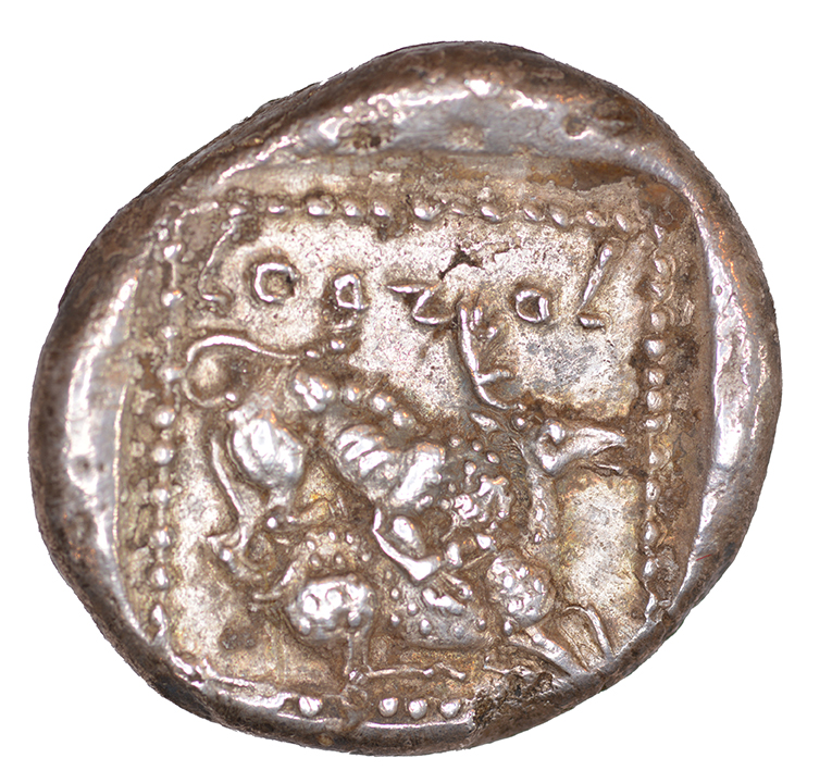 Reverse 'SilCoinCy A1048, acc.no.: KP 1514.6. Silver coin of king Ozibaal of Kition 450 - 425 BC. Weight: 0.92 g, Axis: 4h, Diameter: 22mm. Obverse type: Heracles advancing r. holding club and bow. Obverse symbol: -. Obverse legend: - in -. Reverse type: Lion devouring stag r.. Reverse symbol: -. Reverse legend: L’zb'l in Phoenician. '-', 'BMC Cyprus, A Catalogue of the Greek Coins in the British Museum, Cyprus'.