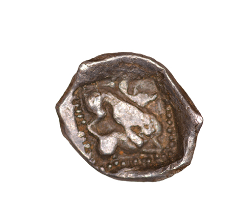 Reverse 'SilCoinCy A1055, acc.no.: KP 531.27. Silver coin of king Uncertain king of Kition of Kition 525 - 480 BC. Weight: 0.34 g, Axis: 12h, Diameter: 9mm. Obverse type: Heracles head r. unbearded with  lion skin headdress. Obverse symbol: -. Obverse legend: - in -. Reverse type: Lion devouring stag r.. Reverse symbol: -. Reverse legend: - in -. '-'.