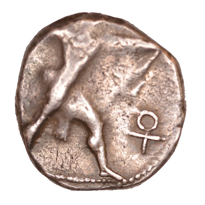 Obverse 'SilCoinCy A1057, acc.no.: KP 1112.6. Silver coin of king Baalmilk II of Kition 425 - 400 BC. Weight: 1.10 g, Axis: 6h, Diameter: 20mm. Obverse type: Heracles advancing r. holding club and bow. Obverse symbol: Ankh. Obverse legend: - in -. Reverse type: Lion devouring stag r.. Reverse symbol: -. Reverse legend: lmlkb’(lrm) in Phoenician. '-'.