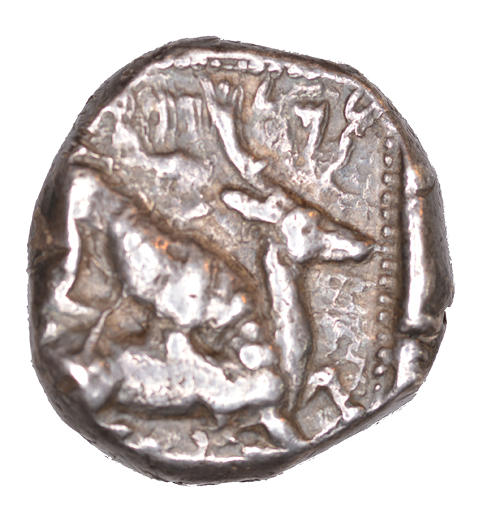 Reverse 'SilCoinCy A1057, acc.no.: KP 1112.6. Silver coin of king Baalmilk II of Kition 425 - 400 BC. Weight: 1.10 g, Axis: 6h, Diameter: 20mm. Obverse type: Heracles advancing r. holding club and bow. Obverse symbol: Ankh. Obverse legend: - in -. Reverse type: Lion devouring stag r.. Reverse symbol: -. Reverse legend: lmlkb’(lrm) in Phoenician. '-'.