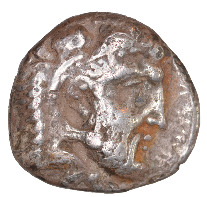 Obverse 'SilCoinCy A1086, acc.no.: KP 1046.108. Silver coin of king Evagoras I of Salamis 411 - 374 BC. Weight: 0.66 g, Axis: 7h, Diameter: 22mm. Obverse type: Heracles head r. bearded with lion skin headdress. Obverse symbol: -. Obverse legend: (e-u)-wa-ko-ro in -. Reverse type: Ram lying r. on exergual line. Reverse symbol: -. Reverse legend: (pa)-si-le-wo-(se) in -. '-', 'Catalogue des monnaies grecques de la Bibliothèque Nationale: les Perses Achéménides, les satrapes et les dynastes tributaires de leur empire: Cypre et la Phénicie'.