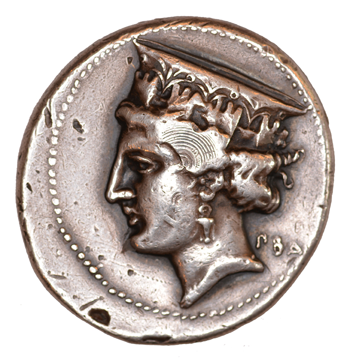 Obverse 'SilCoinCy A1110, acc.no.: 628. Silver coin of king Nikokles (of Paphos) of Paphos 325 - 310 BC. Weight: 6.92 g, Axis: 12h, Diameter: 28mm. Obverse type: Aphrodite head l. with high crown decorated with towers. Obverse symbol: -. Obverse legend: ΠΒΑ in Greek. Reverse type: Apollo seated on the omphalos l. with bow and arrow. Reverse symbol: laurel branch. Reverse legend: ΝΙΚΟΚΛΕΟΥΣ ΠΑΦΙΟΝ in Greek. 'SNG Copenhague, supplement, Acquisitions 1942-1996', 'BMC Cyprus, A Catalogue of the Greek Coins in the British Museum, Cyprus', 'Notes de numismatique chypriote, appendix I. Bronzes du roi Timarchos', 'The Alexander coins of Nicocles of Paphos'.