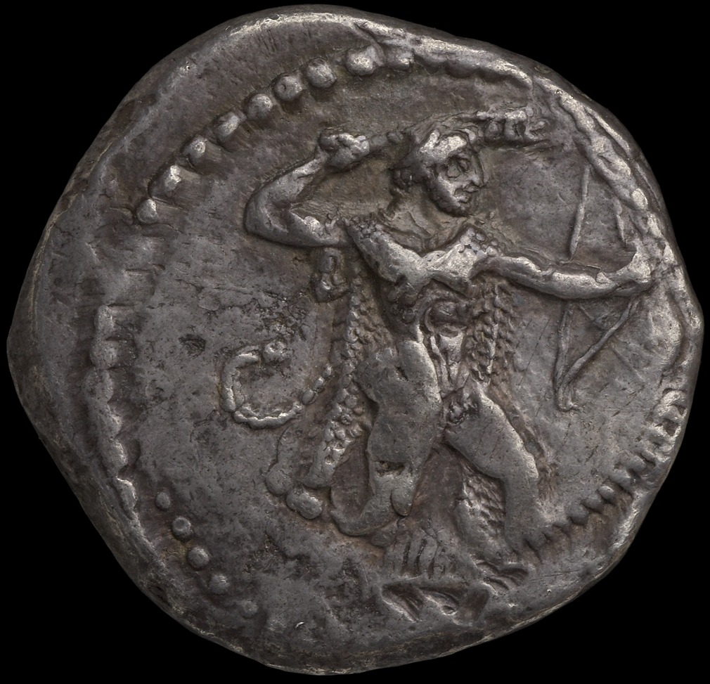 Obverse 'SilCoinCy A1808, acc.no.: HCR 6322. Silver coin of king Ozibaal of Kition 450 - 425 BC. Weight: 10.77g, Axis: 12h, Diameter: 26mm. Obverse type: Heracles advancing r. holding club and bow. Obverse symbol: -. Obverse legend: - in -. Reverse type: Lion devouring stag r.. Reverse symbol: -. Reverse legend: l'zb' in Phoenician. 'BMC Cyprus, A Catalogue of the Greek Coins in the British Museum, Cyprus'.