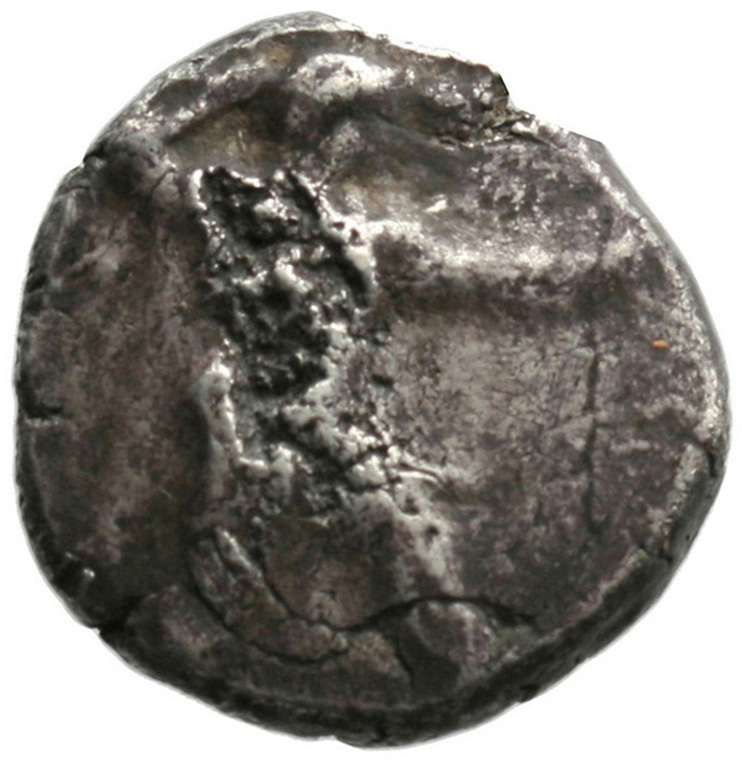 Obverse 'SilCoinCy A1810, acc.no.: . Silver coin of king Ozibaal of Kition 450 - 425 BC. Weight: 11.02g, Axis: 4h, Diameter: 22mm. Obverse type: Heracles advancing r. holding club and bow. Obverse symbol: -. Obverse legend: - in -. Reverse type: Lion devouring stag r.. Reverse symbol: -. Reverse legend: - in -.
