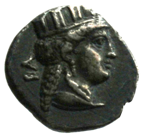 Obverse 'SilCoinCy A1867, acc.no.: . Silver coin of king Nikokreon of Salamis 331 - 310/9 BC. Weight: 2.1g, Axis: 12h, Diameter: 14mm. Obverse type: Aphrodite bust r. with turreted crown. Obverse symbol: -. Obverse legend: BA in Greek. Reverse type: Apollo head l. with laurel wreath and bow. Reverse symbol: -. Reverse legend: NK (monogram) in Greek.