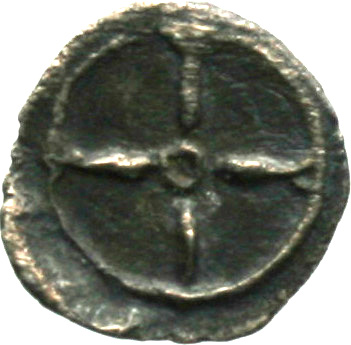 Οπισθότυπος 'SilCoinCy A1869, acc.no.: . Silver coin of king  of  . Weight: 0.51g, Axis: 1h, Diameter: 11mm. Obverse type: Male head youthful r.. Obverse symbol: -. Obverse legend: - in -. Reverse type: Wheel of four spokes. Reverse symbol: -. Reverse legend: - in -.