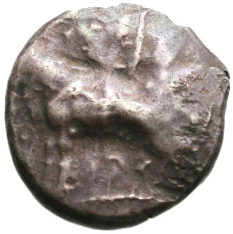 Obverse 'SilCoinCy A1944, acc.no.: . Silver coin of king Onasi(-) of Paphos . Weight: 11.24g, Axis: 12h, Diameter: 22mm. Obverse type: Bull standing l.; above winged solar disk; to l. ankh. Obverse symbol: -. Obverse legend: - in -. Reverse type: Eagle flying l.; astragalos below. Reverse symbol: -. Reverse legend: - in -.