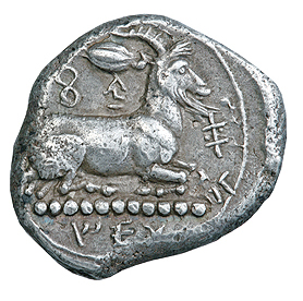 Reverse 'SilCoinCy A5002, Silver coin of king Evagoras I of Salamis 411 - 374 BC. Weight: 10.76g, Axis: 10h, Diameter: 23mm. Obverse type: Κεφαλή γενειοφόρου Ηρακλή (δ). Obverse symbol: -. Obverse legend: e-u-wa-ko-ro in Cypriot syllabic. Reverse type: Τράγος καθήμενος (δ). Επάνω κόκκος κριθής. Reverse symbol: -. Reverse legend: pa-si-le-(o)-se / Ε Υ in Cypriot syllabic.