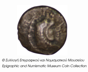 Obverse 'SilCoinCy B4, Kyrou Collection, acc.no.: ΒΠ 1989 - 4. Silver coin of king Baalmilk I of Kition 475 - 450 BC. Weight: 0.47g, Axis: 4h, Diameter: 7mm. Obverse type: Herakles head (no beard) and lion skin r.. Obverse symbol: -. Obverse legend: - in -. Reverse type: Lion seated r.. Reverse symbol: -. Reverse legend: - in -. 'Les monnaies chypriotes dans la collection d'Adonis Kyrou'.