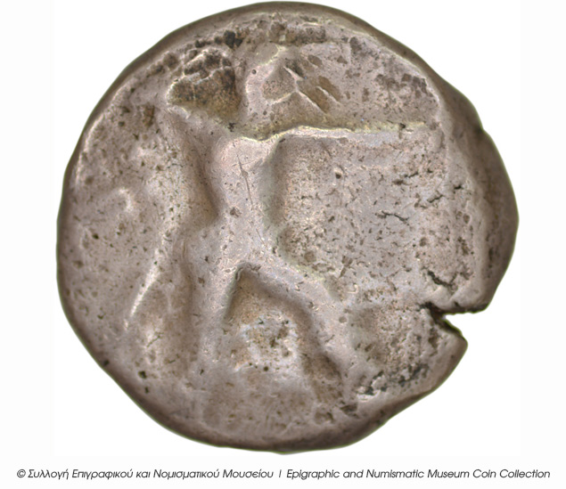 Εμπροσθότυπος 'SilCoinCy B5, Kyrou Collection, acc.no.: ΒΠ 1989 - 5. Silver coin of king Ozibaal of Kition 450 - 425 BC. Weight: 10.76g, Axis: 7h, Diameter: 22mm. Obverse type: Herakles walking r.. Obverse symbol: -. Obverse legend: - in -. Reverse type: Lion devouring stag r.. Reverse symbol: -. Reverse legend: zb' in Phoenician. 'Les monnaies chypriotes dans la collection d'Adonis Kyrou'.